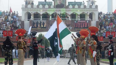 Indian BSF personnel (brown uniforms) and Pakistani Rangers (black uniforms) at the India-Pakistan Wagah Border Post on August 15, 2018. (AFP)