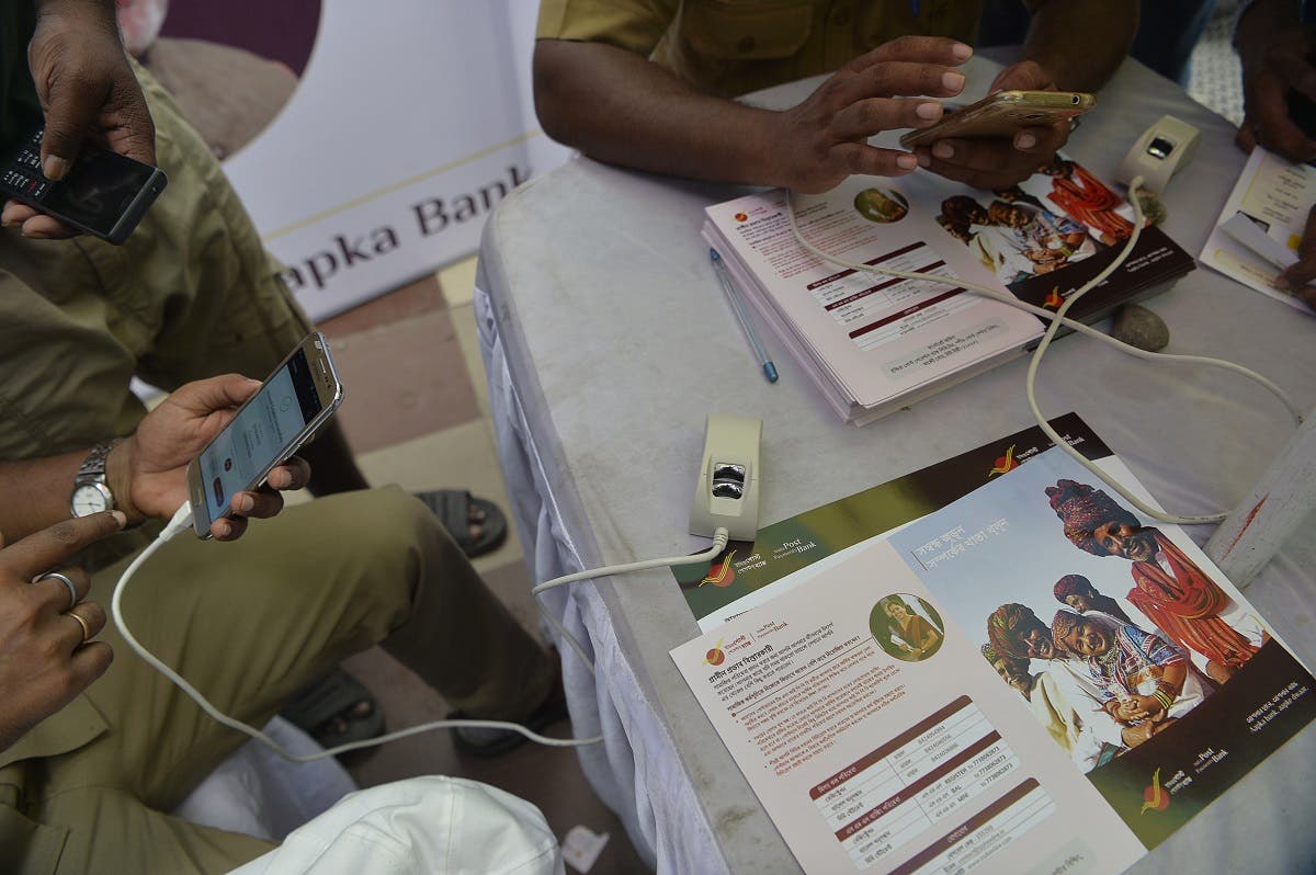 Customers are benefited with savings and current accounts using their mobile phones and aadhar card, also in rural areas. (AFP)