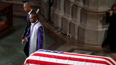 Former President Barack Obama is escorted after speaking at a memorial service for Sen. John McCain. (AP)