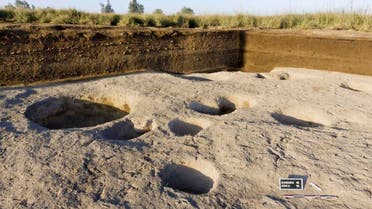 Chief archaeologist Frederic Gio says his team found silos containing animal bones and food, indicating human habitation as early as 5,000 B.C. (AP)