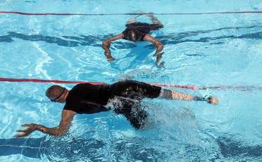 Iraqi civilians who lost limbs during the government offensive against ISIS in Mosul swim during a competitive sports event sponsored by the Kuwaiti government in Erbil. (AFP)