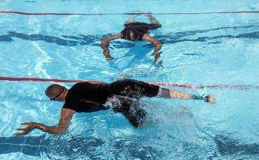 Iraqi civilians who lost limbs during the government offensive against ISIS in Mosul swim during a competitive sports event sponsored by the Kuwaiti government in Erbil. (AFP)