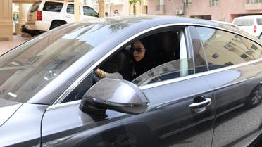 Daniah al-Ghalbi, a newly-licensed Saudi woman driver, sits in her car during a test-drive in the coastal Red Sea city of Jeddah on June 23, 2018. (AFP)