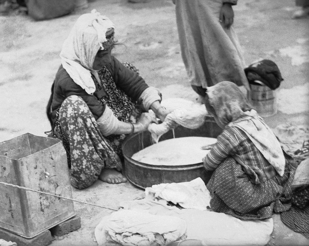 Jewish refugees from Persian Kurdistan in Iraq live in squalor in a camp outside a Jewish cemetery outside Tehran in 1950. (AP)