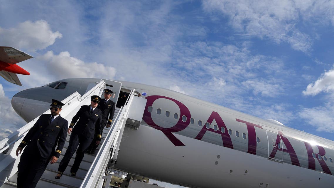 A flight crew disembark from a Qatar Airways Boeing 777 passenger plane in Farnborough, Britain, on July 17, 2018. (Reuters)