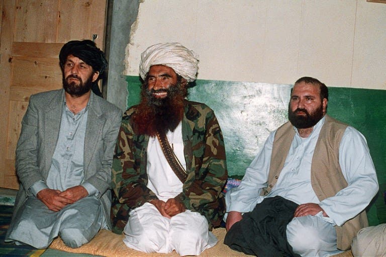 This picture taken on April 2, 1991 shows Afghan commander Jalaluddin Haqqani (C) with two top guerilla commanders Amin Wardak and Abdul Haq at his Pakistani base in Miranshah. (AFP)