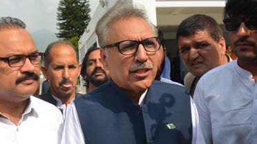 Leader of ruling Pakistan Tehreek-e-Insaf (PTI) party and president candidate Arif Alvi (C) arrives before the president election at the National Assembly in Islamabad. (AFP)