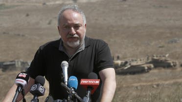 Avigdor Lieberman addresses the media during a visit to the Israel-Syria border in the annexed-Golan Heights on August 7, 2018. (AFP)