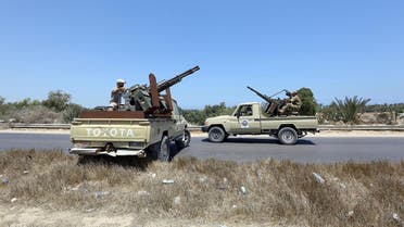Libyan security forces stand guard at a checkpoint on August 23, 2018 at the site of an attack on a checkpoint in the city of Zliten, 170 km east of the capital Tripoli. (AFP)
