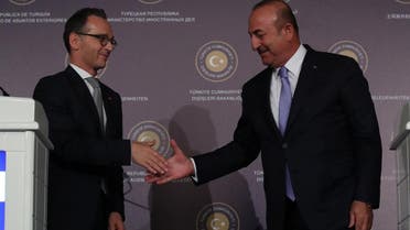 Turkish Foreign Minister Mevlut Cavusoglu shakes hands with his German counterpart Heiko Maas during a news conference in Ankara on September 5, 2018. (Reuters)