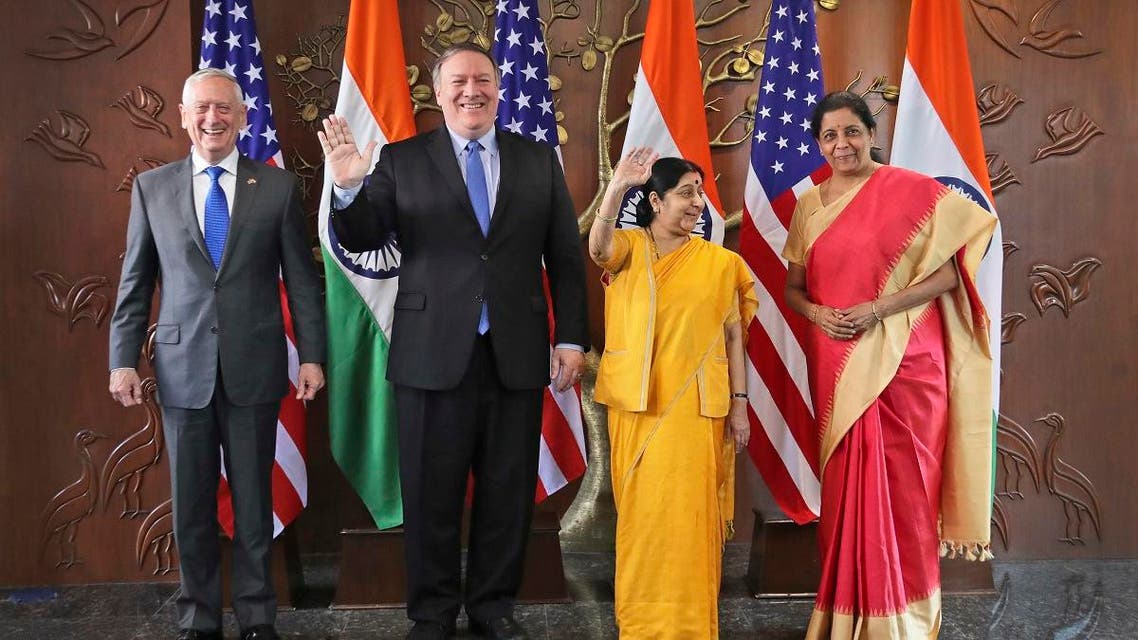 From left, U.S. Defense Secretary James Mattis, U.S. Secretary of State Mike Pompeo, Indian Foreign Minister Sushma Swaraj and Indian Defense Minister Nirmala Sitharaman raise their hands before a meeting in New Delhi, India, Thursday, Sept. 6, 2018. (AP)