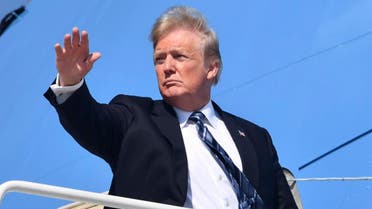 US President Donald Trump waves as he boards Air Force One at Joint Base Andrews, Maryland on September 6, 2018. Trump is heading to Billings, Montana for a fundraiser and rally. (AFP)