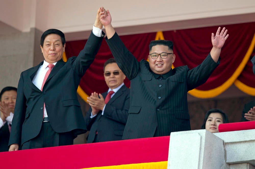 North Korea stages huge parade, holds back on advanced missiles AP
