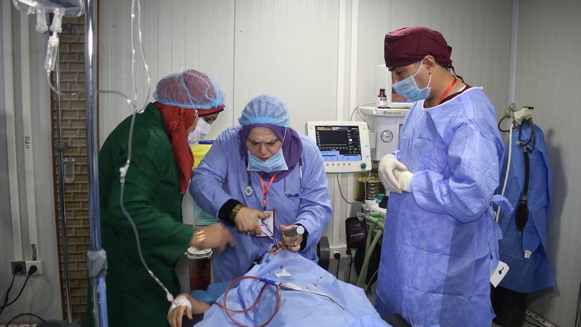 Surgeons operate on a patient at the al-Jamhuri hospital complex in Mosul. (AFP)