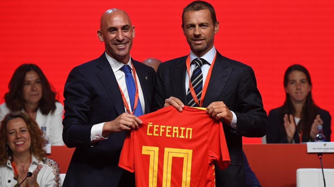 UEFA president Aleksander Ceferin (R) receives a symbolic Spanish football jersey from Spanish Football Federation (RFEF) president Luis Rubiales. (AFP)
