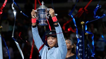 Naomi Osaka holds the trophy after defeating Serena Williams in the US Open final. (AP)