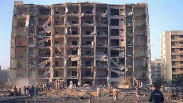 FILE PHOTO: Investigators inspect the Khobar Towers military complex after an attack in Khobar, Saudi Arabia in June 1996. Dept.of Defense/Handout/File Photo via REUTERS. ATTENTION EDITORS - THIS IMAGE WAS PROVIDED BY A THIRD PARTY