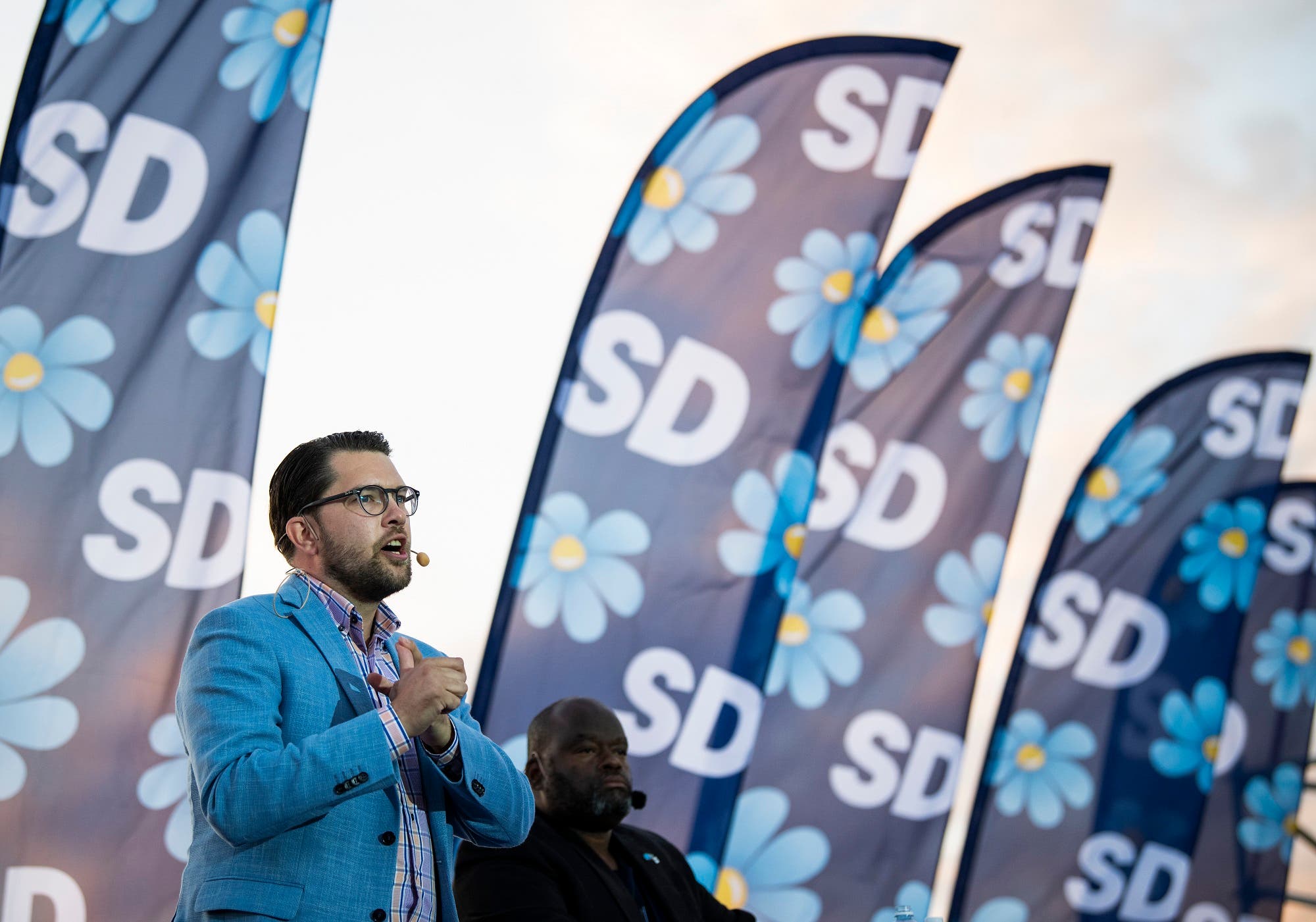 The party leader of the far-right Sweden Democrats, Jimmie Akesson, gives a speech during a campaign meeting in Stockholm on September 8, 2018. (AFP)