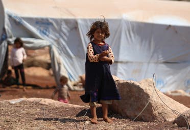 A displaced Syrian girl outside her camp in Kafr Lusin near the border with Turkey in the northern part of Idlib on September 9, 2018. (AFP)