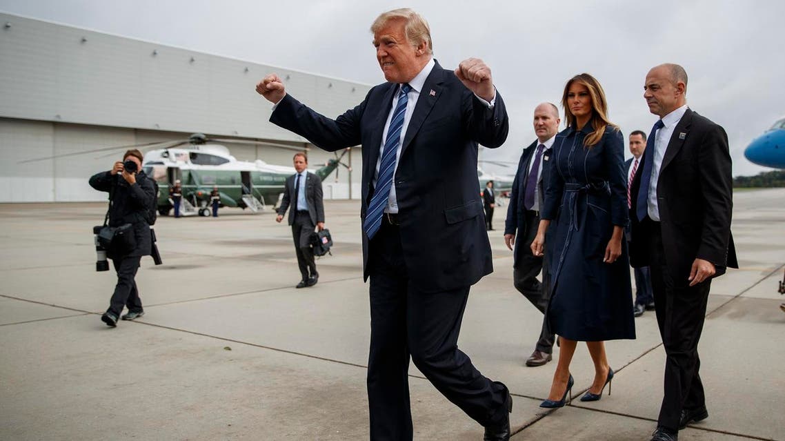 President Donald Trump pumps his fist as he greets supporters after landing at Johnstown-Cambria County Airport, on Tuesday, Sept. 11, 2018, in Johnstown, Pa. (AP)