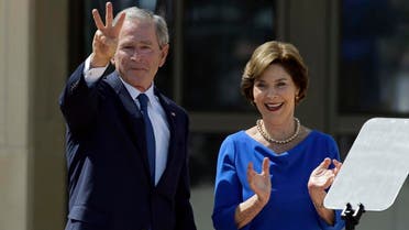File photo of former President George W. Bush, accompanied by his wife, former first lady Laura Bush. (AP)