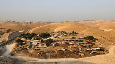 Khan al-Ahmar is beside an Israeli highway that runs through the West Bank from Jerusalem to the Dead Sea. (AFP)