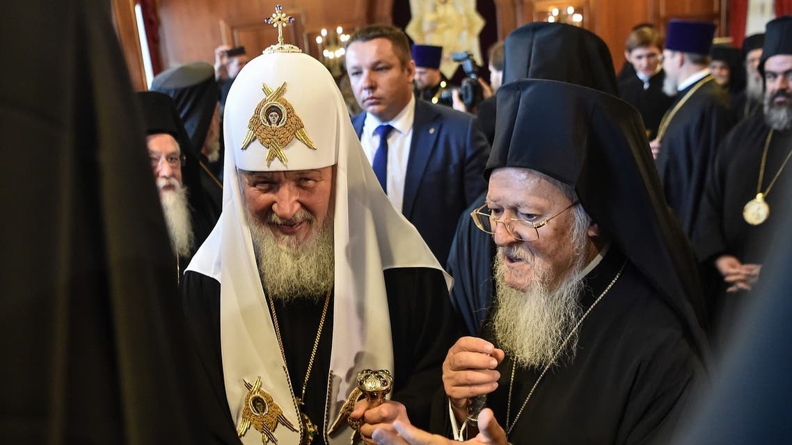 Greek Orthodox Ecumenical Patriarch Bartholomew I (R) and members of to the clergy greet Patriarch of Moscow and All Russia Kirill (C) during their meeting at St George church, the main Greek Orthodox cathedral during his visit on August 31, 2018 in Istanbul. (AFP)