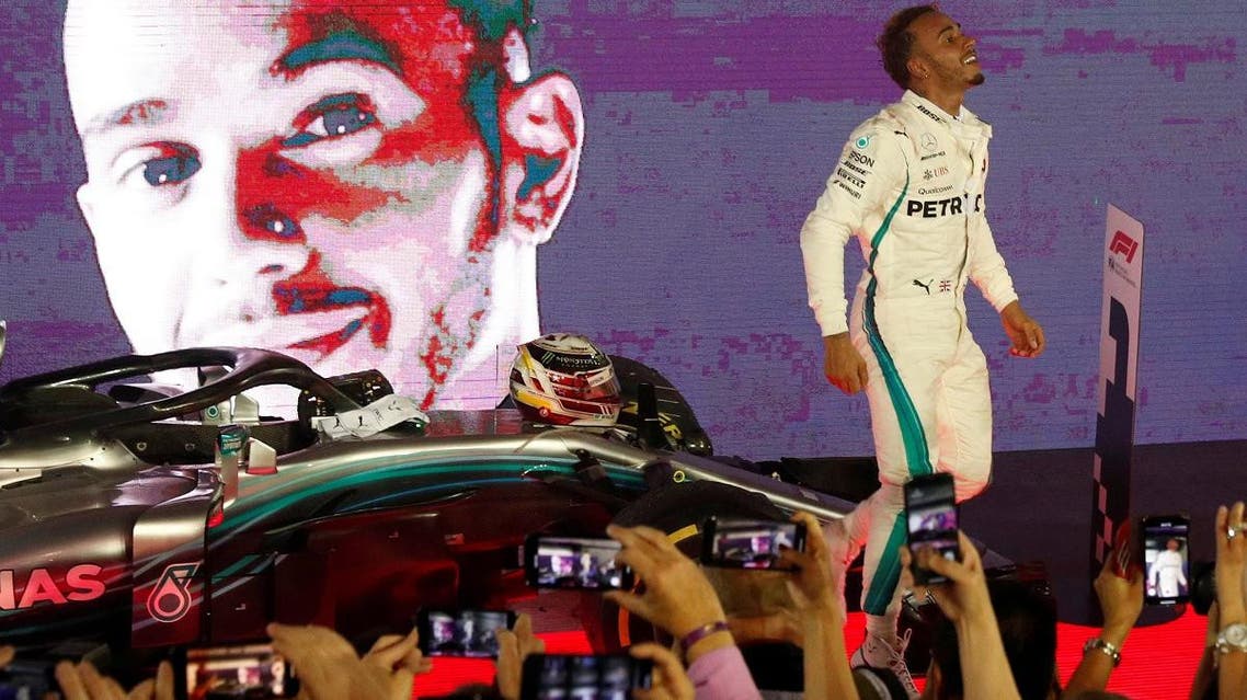 Mercedes’ Lewis Hamilton celebrates after winning the race at the Singapore Grand Prix - Marina Bay Street Circuit, on September 16, 2018. (Reuters)