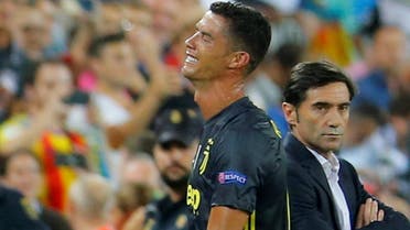 Juventus’ Cristiano Ronaldo reacts after he is sent off while Valencia coach Marcelino Garcia looks on. (Reuters) 
