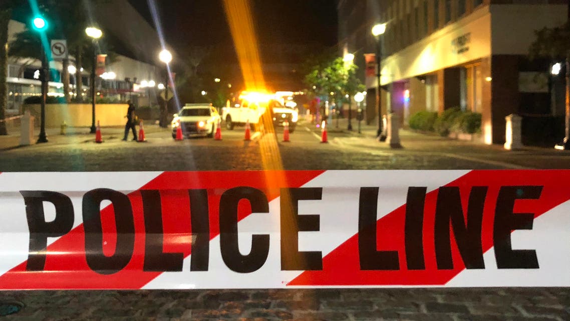 File photo showing a police car behind police tape blocking a street in the US. (AFP)