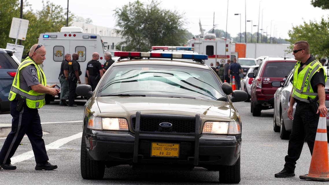Aberdeen police officers blocks the entrance of industrial complex where several people had been shot, in Harford County, Maryland, on Sept. 20, 2018. (AP)