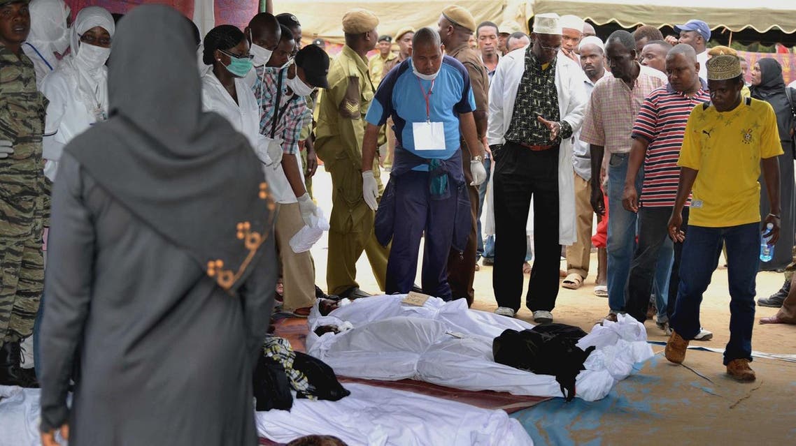 People identify victims of a ferry accident at Maisara grounds in Stone Town, Zanzibar, Tanzania, on Thursday July 19, 2012. (AP)