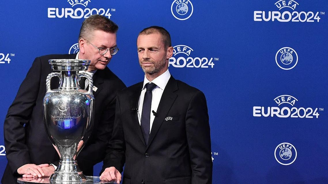German Football Association (DFB) president Reinhard Grindel (L) and UEFA president Aleksander Ceferin (AFP)