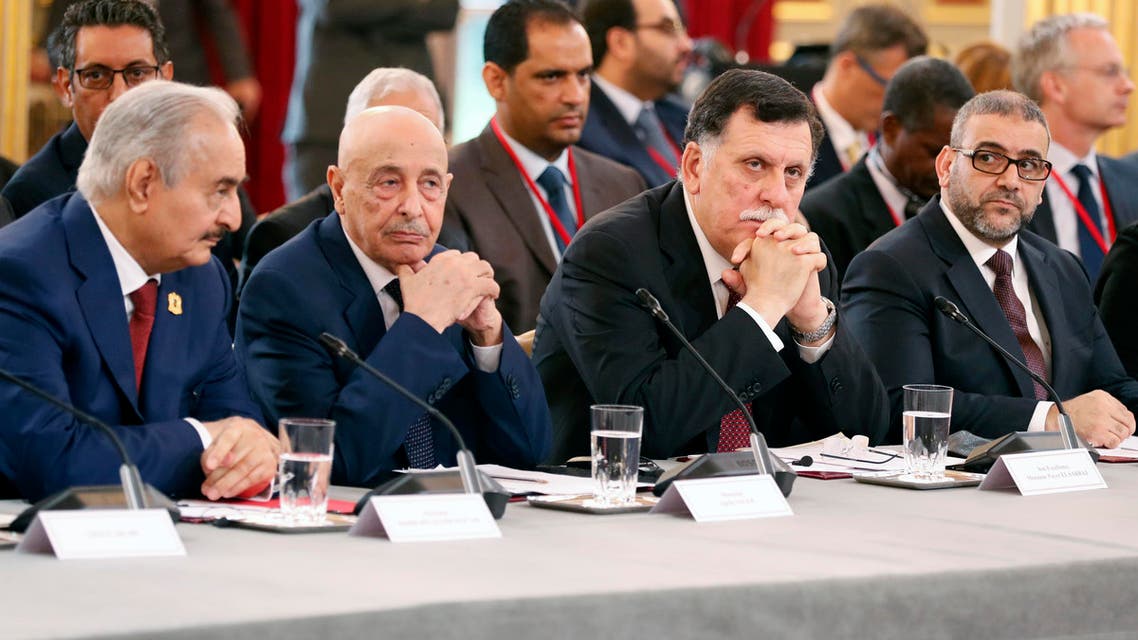(From L) Libyan National Army's Field Marshal Khalifa Haftar, Libya's parliament speaker based in the eastern town of Tobruk Aguila Saleh Issa, Libya's Presidential Council of the Government of National Accord Fayez al-Sarraj, and President of the High Council of State of Libya Khaled Mechri attend an International Congress on Libya at the Elysee Palace in Paris, on May 29, 2018. Rival Libyan leaders vying for influence in the fractured and war-scarred country meet in Paris for a major peace conference seen as a risky French-backed push for a political settlement in the country.