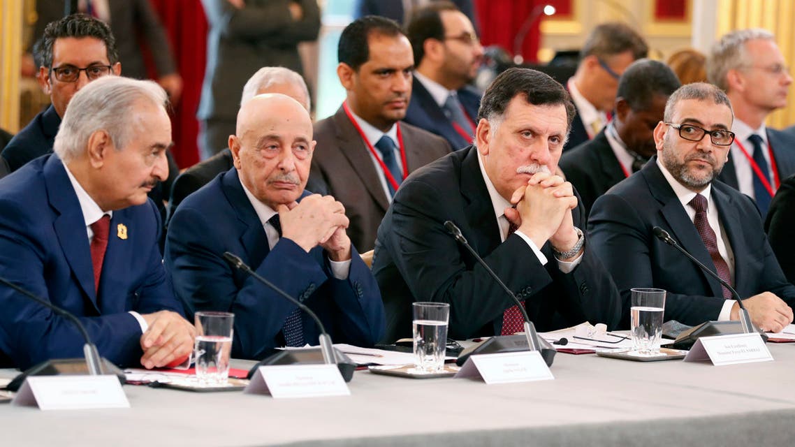 (From L) Libyan National Army's Field Marshal Khalifa Haftar, Libya's parliament speaker based in the eastern town of Tobruk Aguila Saleh Issa, Libya's Presidential Council of the Government of National Accord Fayez al-Sarraj, and President of the High Council of State of Libya Khaled Mechri attend an International Congress on Libya at the Elysee Palace in Paris, on May 29, 2018. Rival Libyan leaders vying for influence in the fractured and war-scarred country meet in Paris for a major peace conference seen as a risky French-backed push for a political settlement in the country.