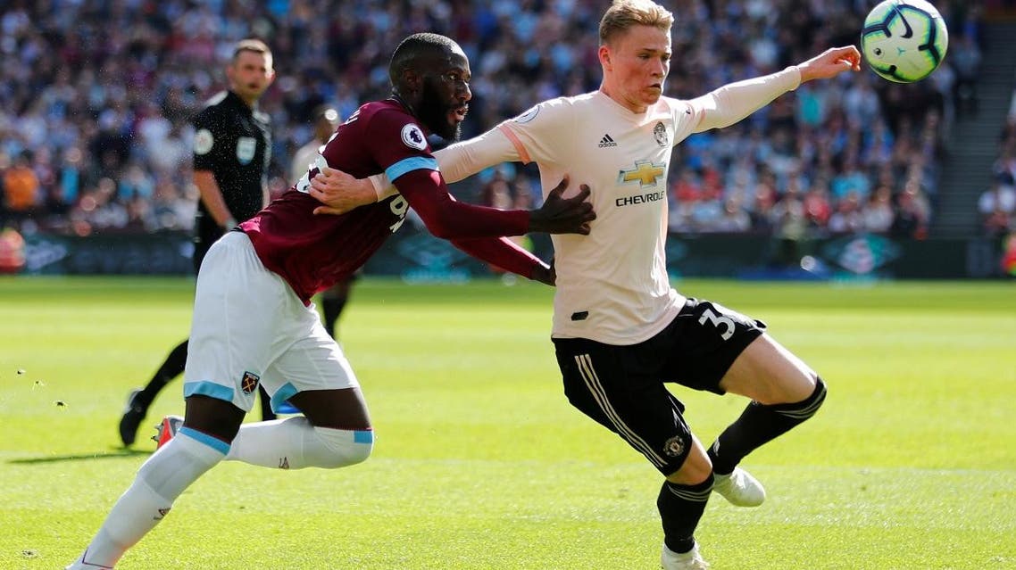 Manchester United’s Scott McTominay in action with West Ham’s Arthur Masuaku. (Reuters)