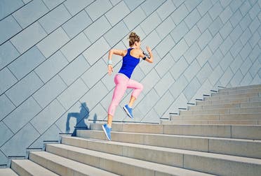 A woman running up a flight of stairs as part of her exercise routine. (File photo: Stock images)