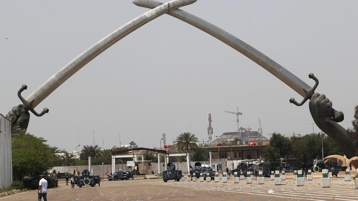 Iraqis visit the "Crossed Swords monument" in Baghdad's heavily fortified "Green Zone" on May 1, 2016, the day after supporters of Shiite cleric Moqtada al-Sadr broke into the area after lawmakers again failed to approve new ministers.