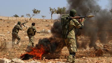 Syrian militant fighters take part in combat training at an unknown location in the northern countryside of the Idlib province. (AFP file photo)