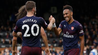 Arsenal’s Aubameyang, right, celebrates after scoring his side’s fifth goal against Fulham in London, on Oct. 7, 2018. (AP)