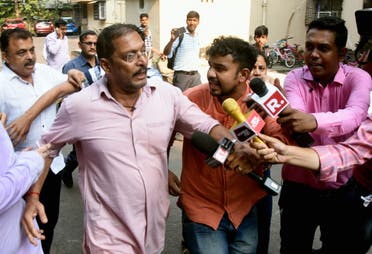 Bollywood actor Nana Patekar is mobbed by the media as he leaves after making a statement in Mumbai on October 8, 2018. (AFP)