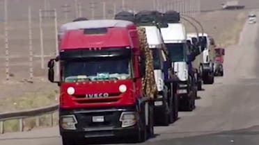 This image made from video broadcast on Iranian State Television shows trucks outside Fordo nuclear facility in Iran on Monday, Aug. 29, 2016. (Iran State Television via AP)