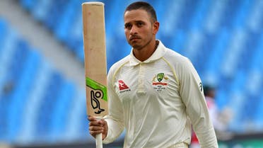 Australian cricketer Usman Khawaja leaves the pitch after being dismissed by Pakistan batsman Yasir Shah during day five of the first Test cricket match in Dubai on October 11, 2018. (AFP)