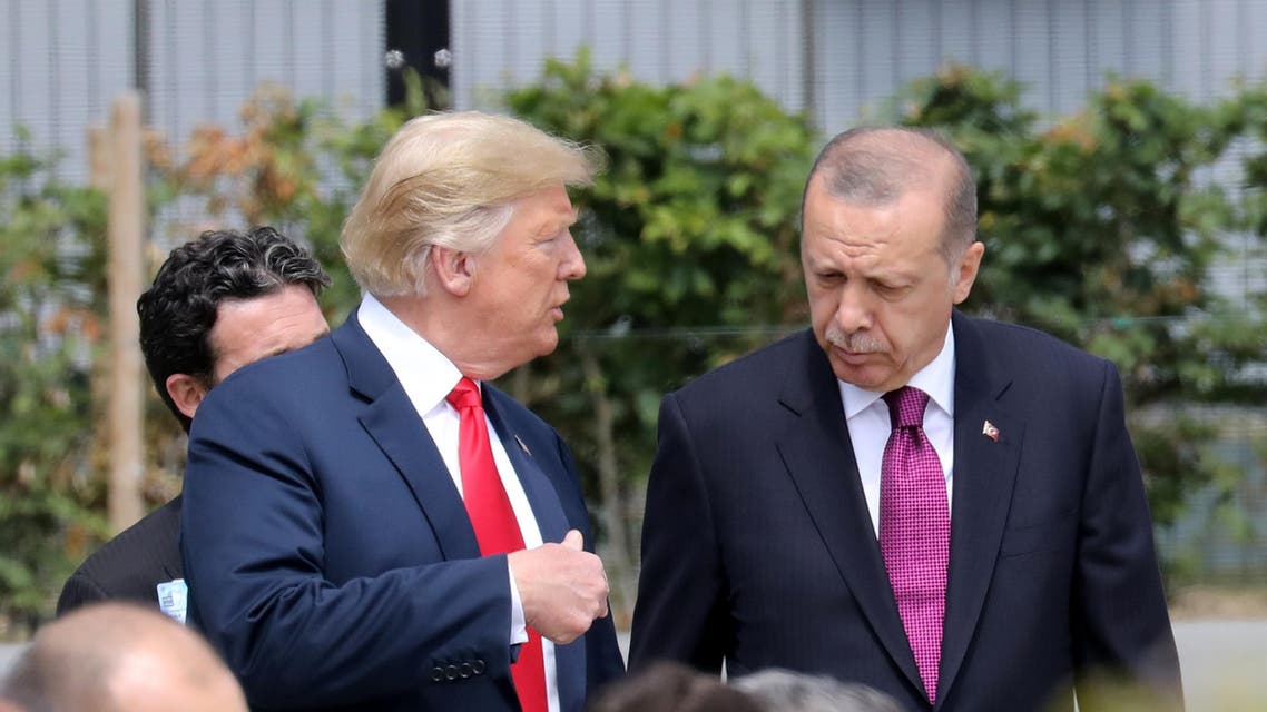 US President Donald Trump (L) speaks to Turkey's President Recep Tayyip Erdogan during the opening ceremony of the NATO (North Atlantic Treaty Organization) summit, at the NATO headquarters in Brussels, on July 11, 2018.
