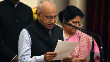 Bharatiya Janata Party politician, M. J. Akbar takes the oath during the swearing-in ceremony of new ministers following Prime Minister Narendra Modi’s cabinet re-shuffle, at the Presidential Palace in New Delhi on July 5, 2016. (AFP)