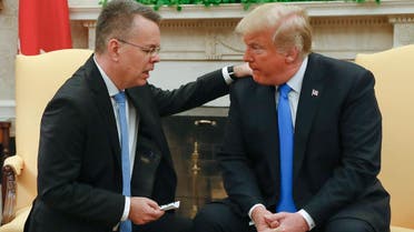 Freed American pastor Andrew Brunson (C) looks on as his wife shakes hands with US President Donald Trump after a meeting in the Oval Office at the White House in Washington, DC, October 13, 2018. (AFP)