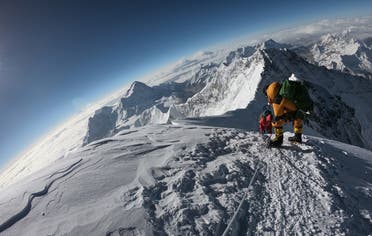 In this photo taken on May 17, 2018, mountaineers make their way to the summit of Mount Everest, as they ascend on the south face from Nepal. (AFP)