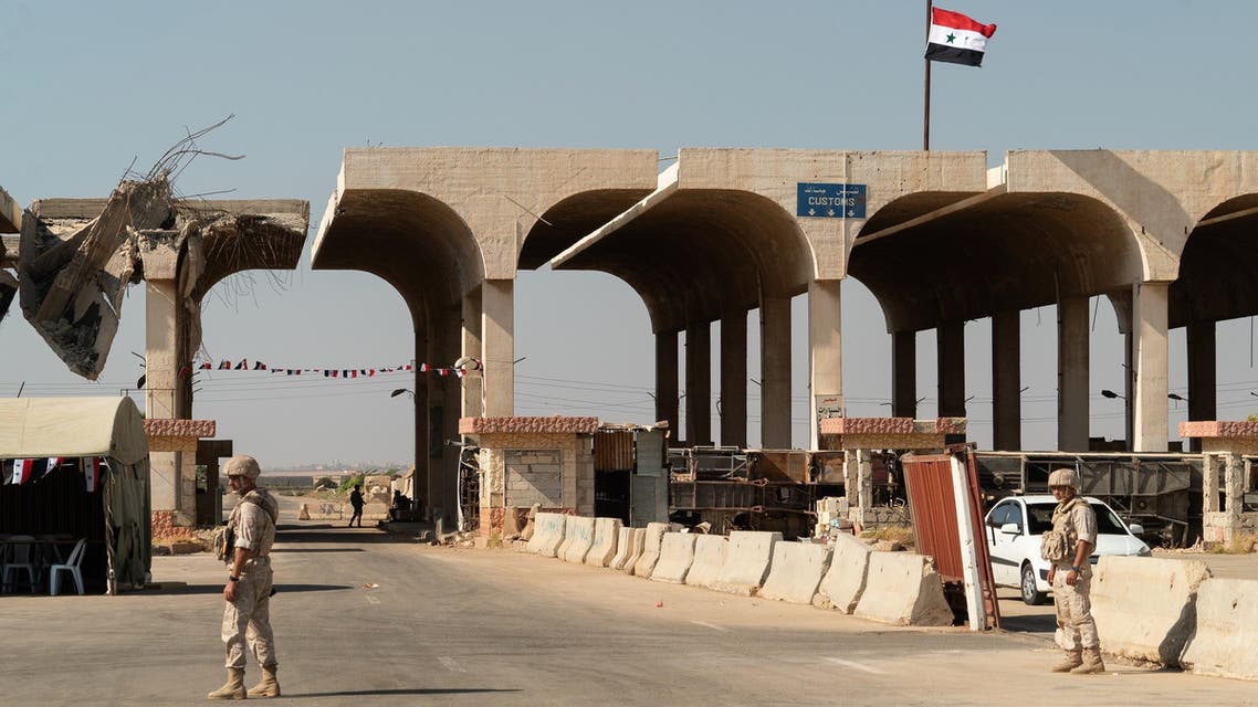 Members of the Russian military police patrol the Nassib border crossing with Jordan in the southern Syrian province of Daraa on August 14, 2018. (AFP)