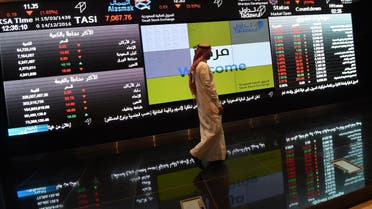 A Saudi investor monitors the Saudi Stock Exchange, or Tadawul, on December 14, 2016 in. (AFP)