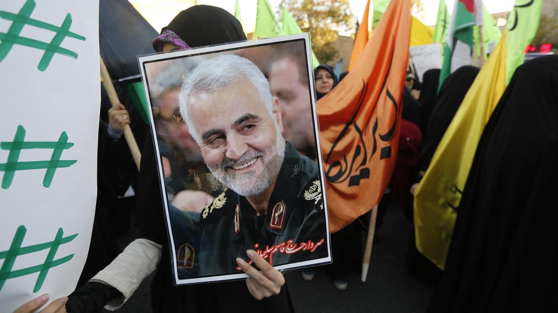 Iranian protesters hold a portrait of Gen. Qassem Suleimani, during a demonstration in Tehran on December 11, 2017. (AFP)